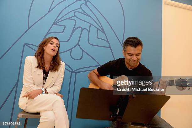 Musician/actress Sophie Auster performs at Warby Parker's store opening in The Standard, Hollywood on August 15, 2013 in Los Angeles, California.