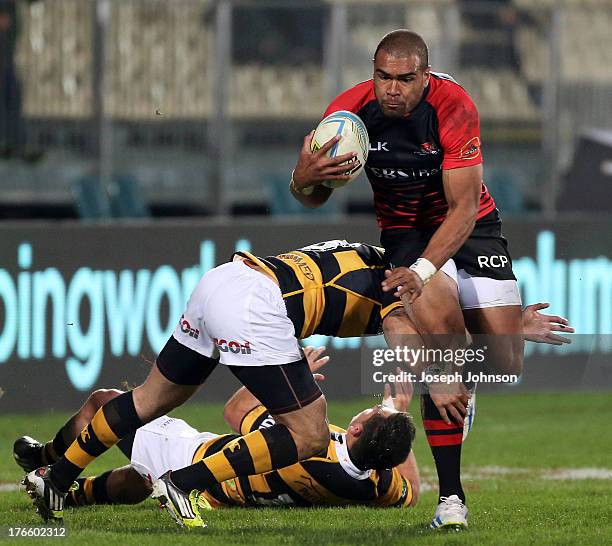 Patrick Osborne of Canterbury with the ball in the tackle of Andre Taylor of Taranaki during the round 1 ITM Cup match between Cantebury and Taranaki...