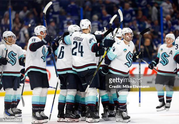 Jared McCann of the Seattle Kraken celebrates a goal in overtime during a game against the Tampa Bay Lightning at Amalie Arena on October 30, 2023 in...