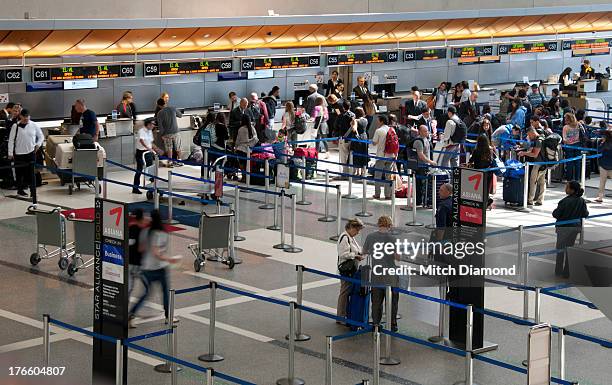 airport passengers in lines - queue system stock pictures, royalty-free photos & images