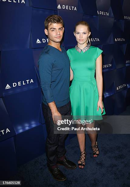 Actors Garrett Clayton and Claudia Lee attend the Delta Air Lines summer celebration In Beverly Hills on August 15, 2013 in Beverly Hills, California.