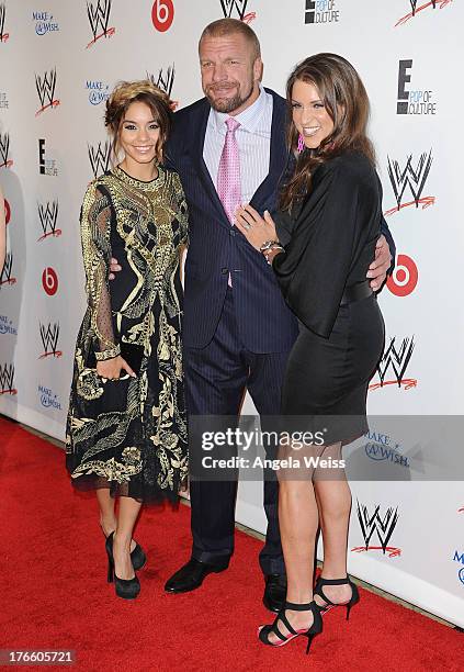 Actress Vanessa Hudgens, professional wreslter Paul Levesque and WWE Executive Vice President of Creative Stephanie McMahon arrive at WWE and E!...