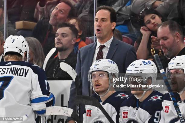 Associate coach of the Winnipeg Jets, Scott Arniel, handles bench duties during overtime against the Montreal Canadiens at the Bell Centre on October...