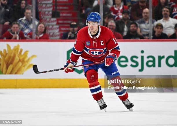 Nick Suzuki of the Montreal Canadiens skates during overtime against the Winnipeg Jets at the Bell Centre on October 28, 2023 in Montreal, Quebec,...