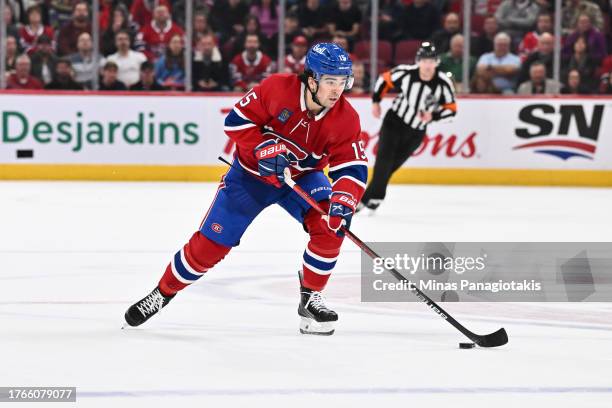 Alex Newhook of the Montreal Canadiens skates the puck during overtime against the Winnipeg Jets at the Bell Centre on October 28, 2023 in Montreal,...