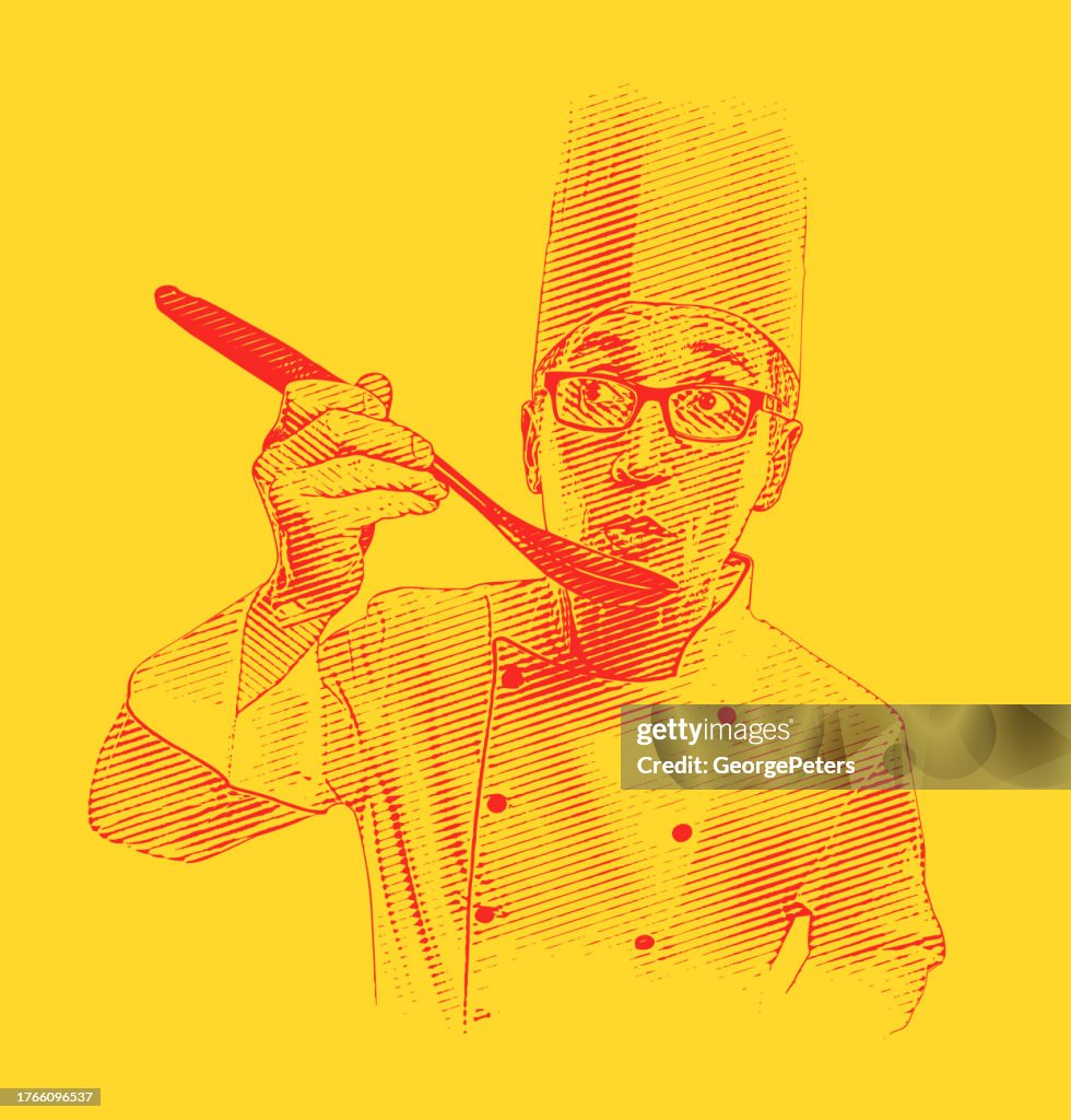 Chef masculino probando su cocina