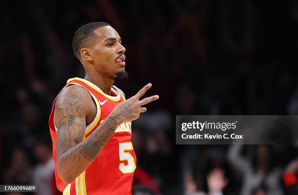 Dejounte Murray of the Atlanta Hawks reacts after hitting a three-point basket against the Minnesota Timberwolves during the third quarter at State...