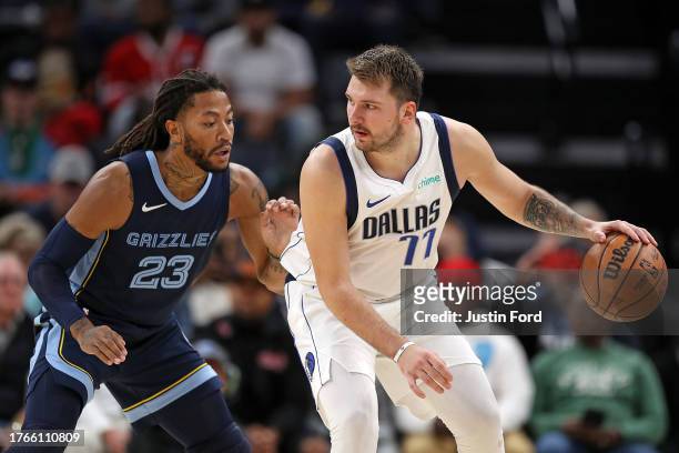 Luka Doncic of the Dallas Mavericks handles the ball against Derrick Rose of the Memphis Grizzlies during the second half at FedExForum on October...