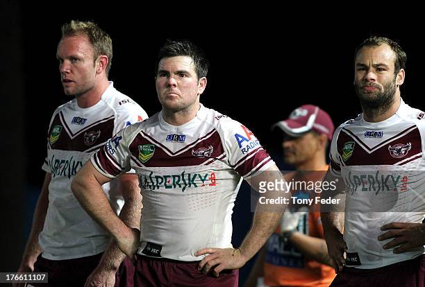 David Gower , Jamie Lyon and Brett Stewart looking dejected after losing to the Rabbitohs during the round 23 NRL match between the South Sydney...