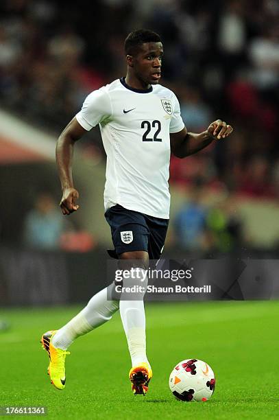 Wilfried Zaha of England runs with the ball during the International Friendly match between England and Scotland at Wembley Stadium on August 14,...