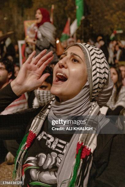 Washington DC, USA. A woman shouts slogans during a demonstration of solidarity with Palestinians. Demonstrators gathered in Freedom Plaza for a...