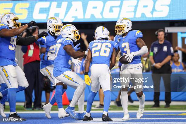 Derwin James Jr. #3 of the Los Angeles Chargers celebrates his interception with teammates in the fourth quarter against the Chicago Bears at SoFi...