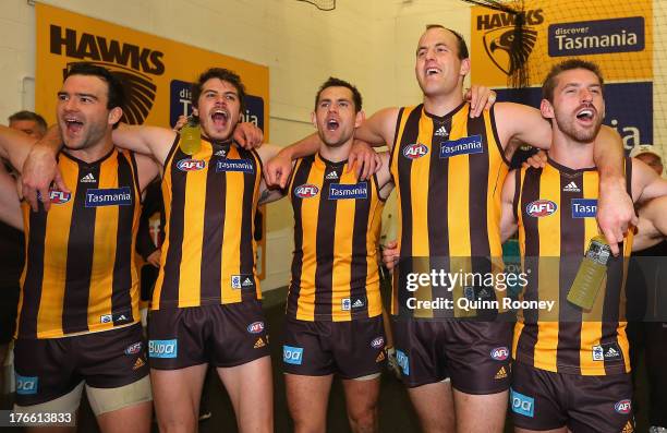 Jordan Lewis, Isaac Smith, Luke Hodge, David Hale and Brendan Whitecross of the Hawks sing the song in the rooms after winning the round 21 AFL match...
