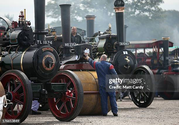 An exhibitor prepares a steam engine to show at the Cornish Steam and Country Fair at the Stithians Showground on August 16, 2013 near Penryn,...