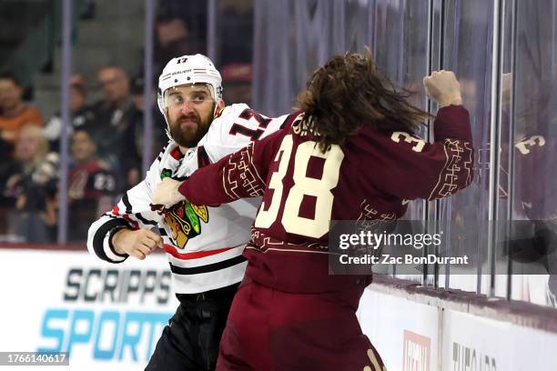 Nick Foligno of the Chicago Blackhawks and Liam O'Brien of the Arizona Coyotes fight during the first period at Mullett Arena on October 30, 2023 in...