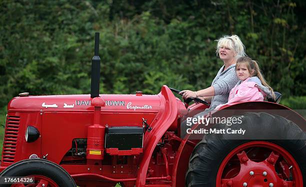 Vintage tractor is driven into the showground at the Cornish Steam and Country Fair at the Stithians Showground on August 16, 2013 near Penryn,...
