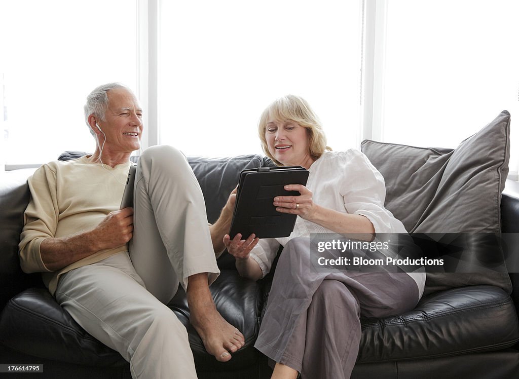 Mature couple looking at a tablet together