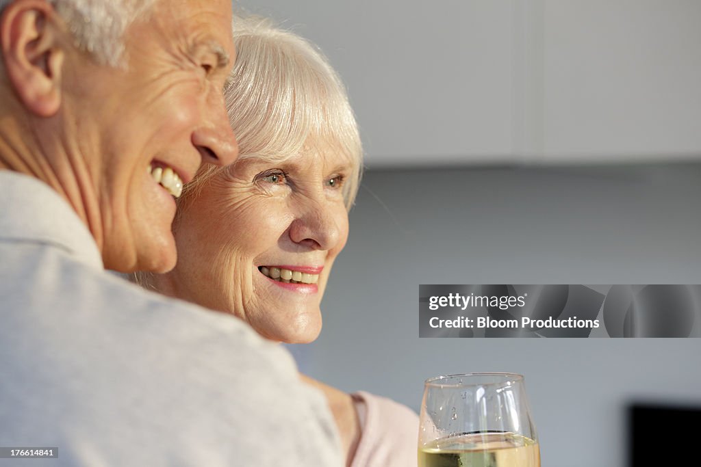 Portrait of mature couple having a glass of wine