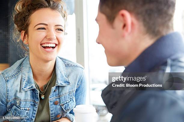 late teens girl and boy laughing - boy girl stock pictures, royalty-free photos & images