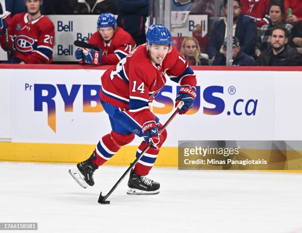 Nick Suzuki of the Montreal Canadiens skates the puck during the second period against the Winnipeg Jets at the Bell Centre on October 28, 2023 in...
