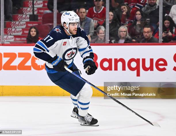 Adam Lowry of the Winnipeg Jets skates during the third period against the Montreal Canadiens at the Bell Centre on October 28, 2023 in Montreal,...