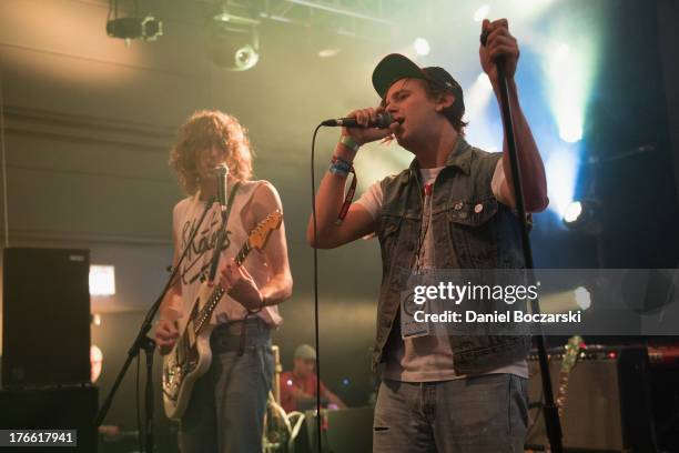 Joshua Hubbard and Michael Ian Cummings of Skaters perform on stage at Hard Rock Hotel Chicago on August 4, 2013 in Chicago, Illinois.