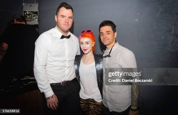 Chad Gilbert, Hayley Williams and Chris Carraba pose backstage at Red 7 during Day 5 of SXSW 2013 Music Festival on March 16, 2013 in Austin, Texas.