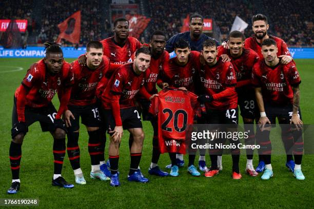 Players of AC Milan pose for a team photo holding a jersey of Pierre Kalulu prior to the Serie A football match between AC Milan and Udinese Calcio....