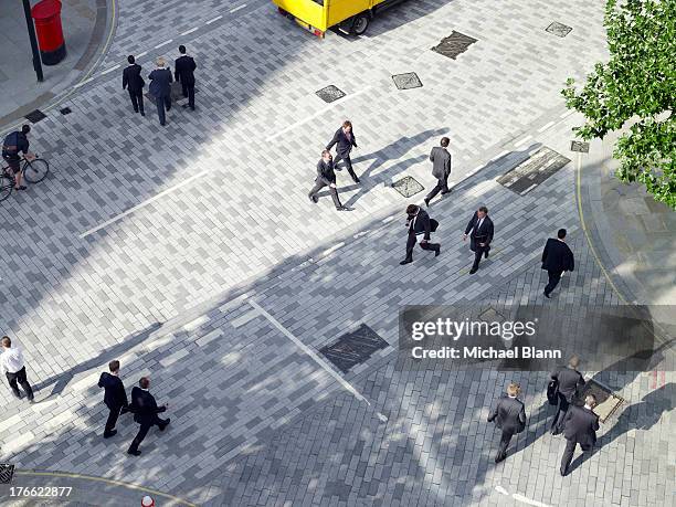 business people walking across a road, aerial view - pedestrian street stock pictures, royalty-free photos & images