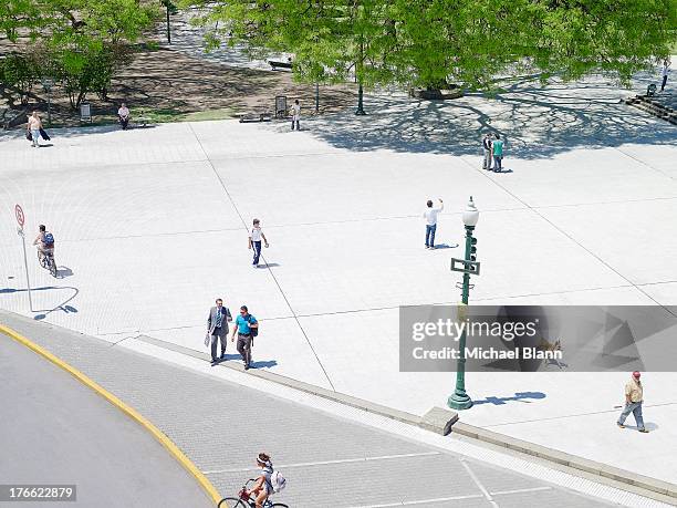 people in city park seen from above, aerial - dog stock photos et images de collection