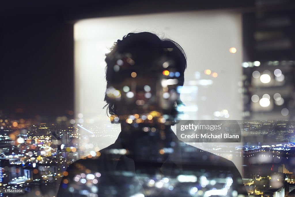 Silhouette of business man against city