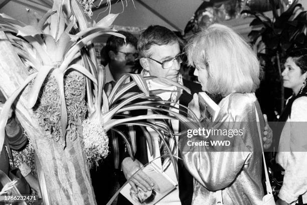 Roddy McDowall and Angie Dickinson attend a party in Beverly Hills, California, on June 25, 1987.