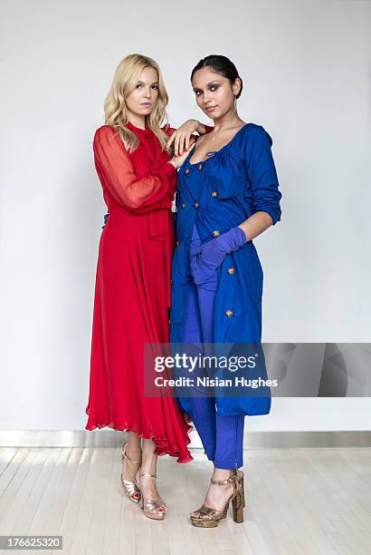 two beautiful young woman standing together - blue dress stock pictures, royalty-free photos & images