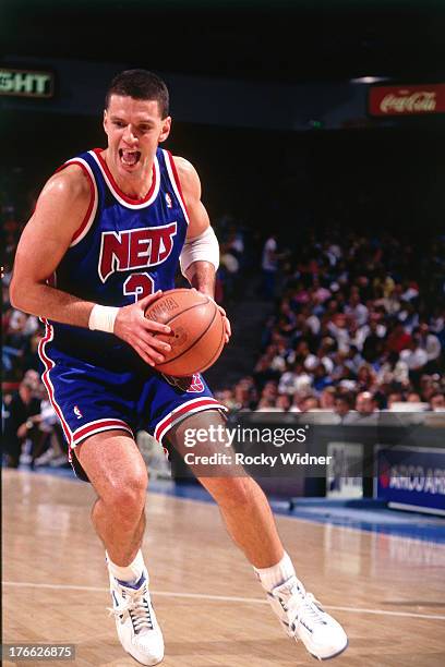 Drazen Petrovic of the New Jersey Nets dribbles the ball against the Sacramento Kings on November 28, 1992 at Arco Arena in Sacramento, California....