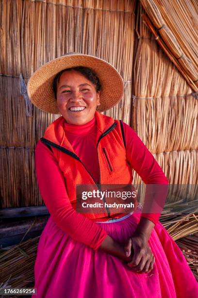 peruvian woman on uros floating island, lake tititcaca - floating island stock pictures, royalty-free photos & images