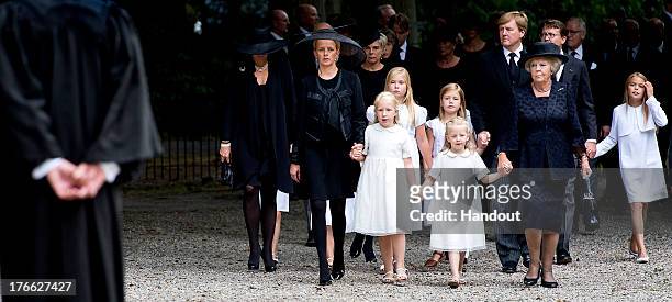 In this handout image provided by ANP, Princess Mabel of the Netherlands walks with her daughters Countess Luana and Countess Zaria of the...