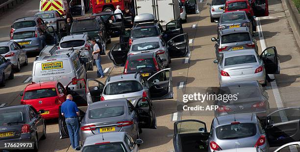 Motorists are stranded on the M25 after a road accident closed a section of the motorway orbital in London on August 16, 2013. Eight people were...
