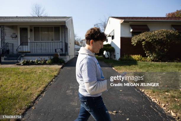 Pro-Choice canvasser Lorie McLain looks at a map on her phone while canvassing in a neighborhood ahead of the general election in Columbus, Ohio on...