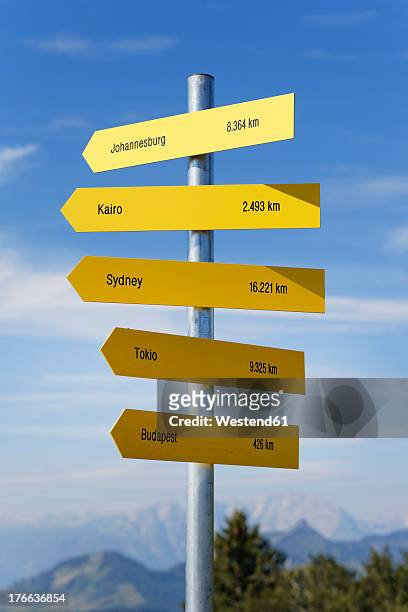 austria, salzkammergut, arrow signs at zwoelferhorn mountain near st. gilgen - directional signs stock pictures, royalty-free photos & images