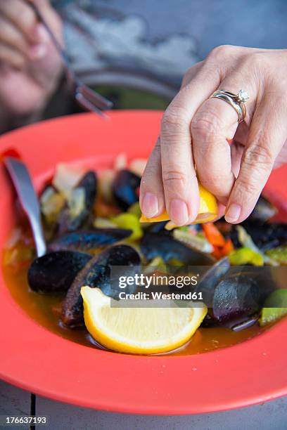 usa, texas, mature woman enjoying mussels dish in restaurant, close up - corpus christi stock pictures, royalty-free photos & images