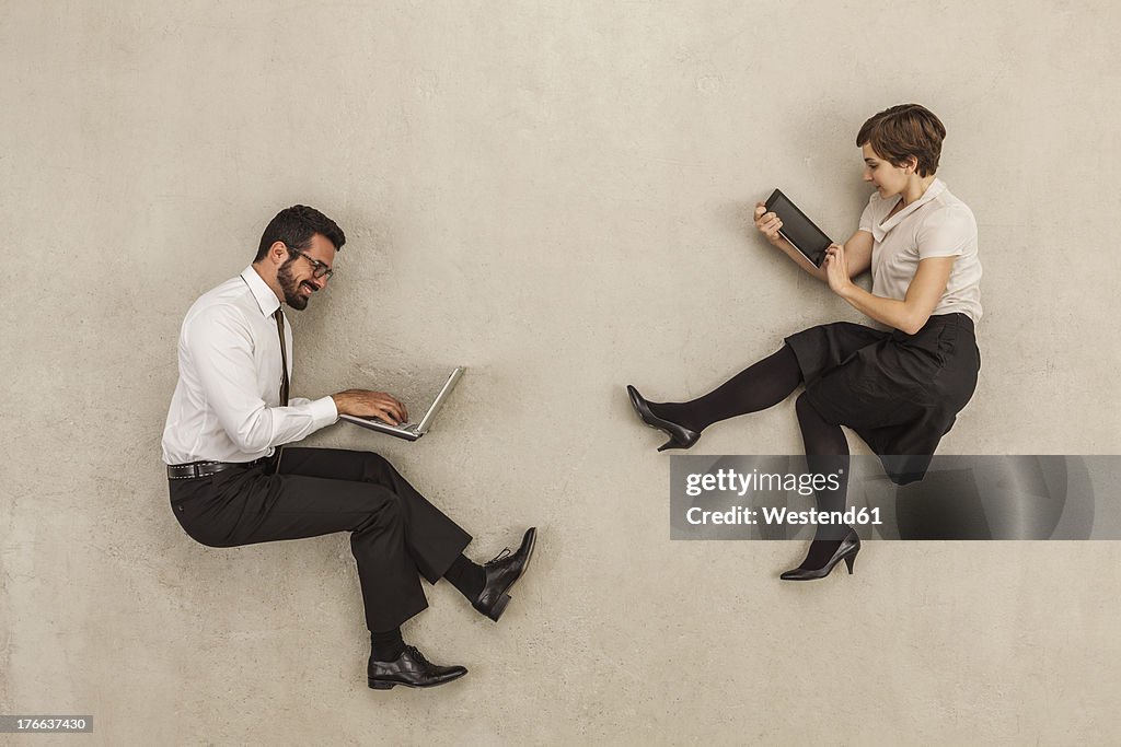 Business people working on laptop and digital tablet