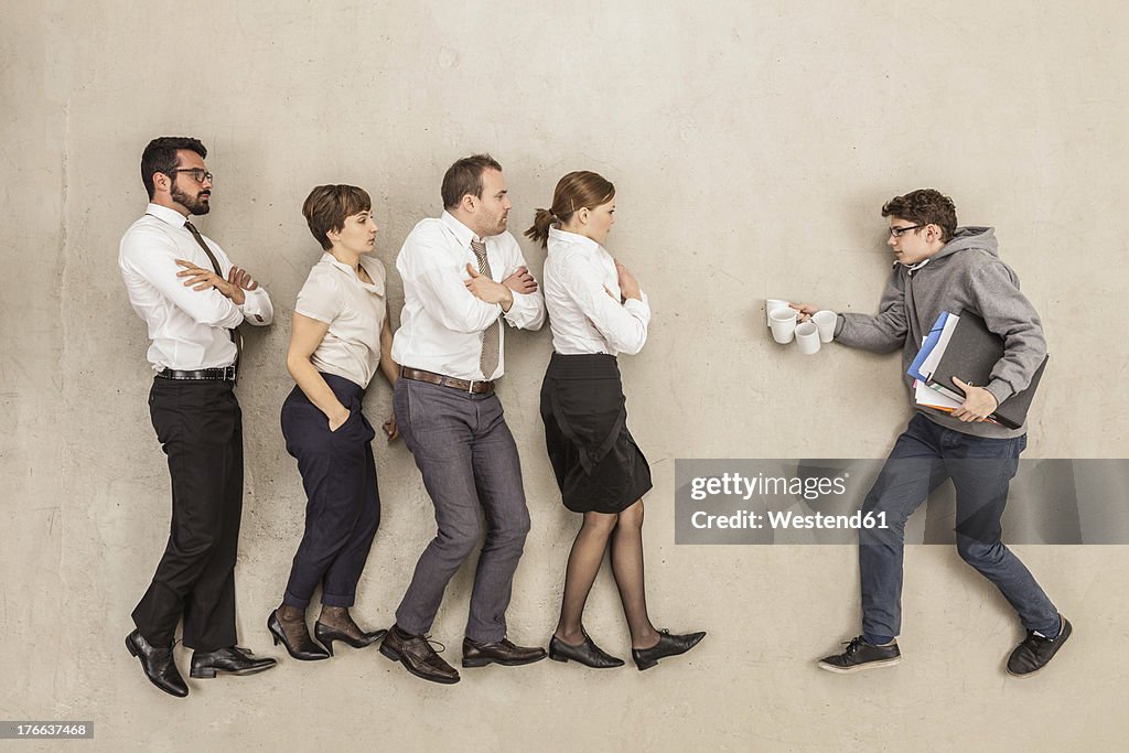 Coffee boy at service for business people in office