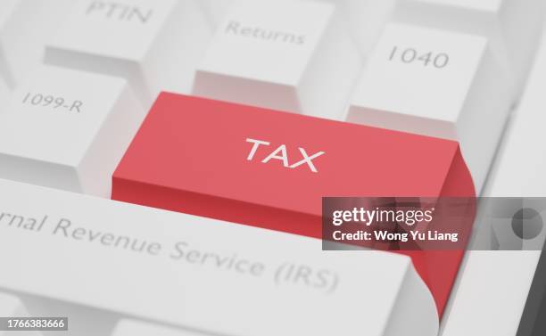 tax and keyboard key concept - filing documents stock pictures, royalty-free photos & images