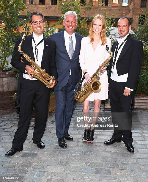 Alexander Schuhmacher and Maike van Grieken with musicians attend the 12th Audi Classic Open Air during the AUDI Sommernacht at Kulturbrauerei on...