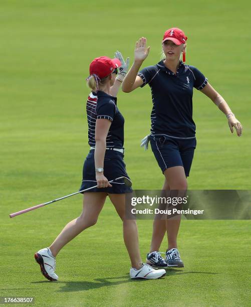 Morgan Pressel and Jessica Korda of the United States celebrate on the 16th fairway as they defeated Azahara Munoz of Spain and Karine Icher of...