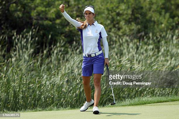 Azahara Munoz of Spain playing for the European Team celebrates as she sinks a putt on the 17th hole to clinch victory with her teammate Karine Icher...