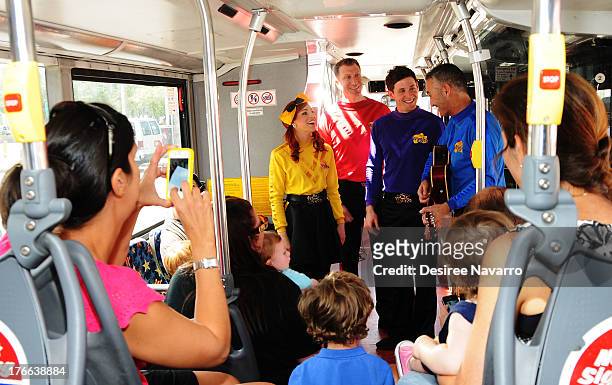 Emma Watkins, Simon Pryce, Lachlan Gillespie and Anthony Field of The Wiggles attend Meet The Wiggles at Pier 78 on August 16, 2013 in New York City.