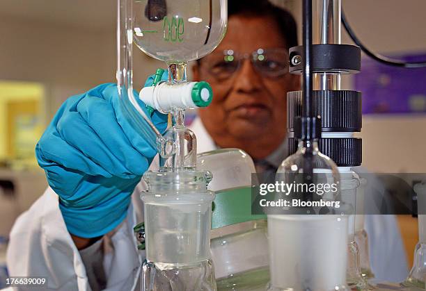 Dinu Shah, director of formulation sciences at Transdermal Delivery Solutions, mixes a testosterone solution, in Palm Beach Gardens, Florida, U.S.,...