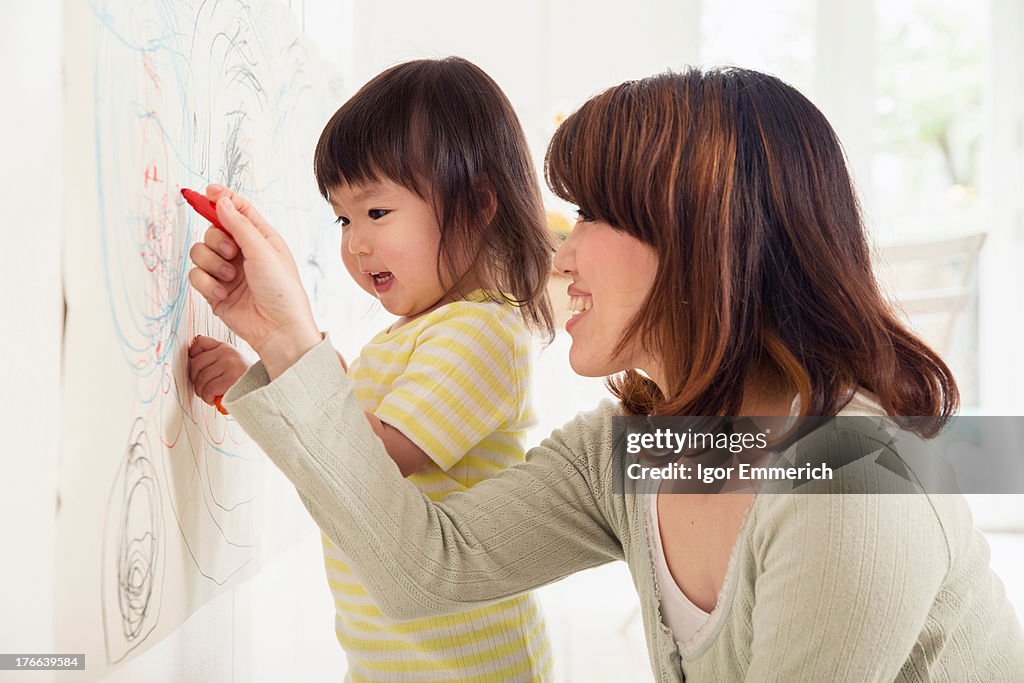 Mother and daughter drawing