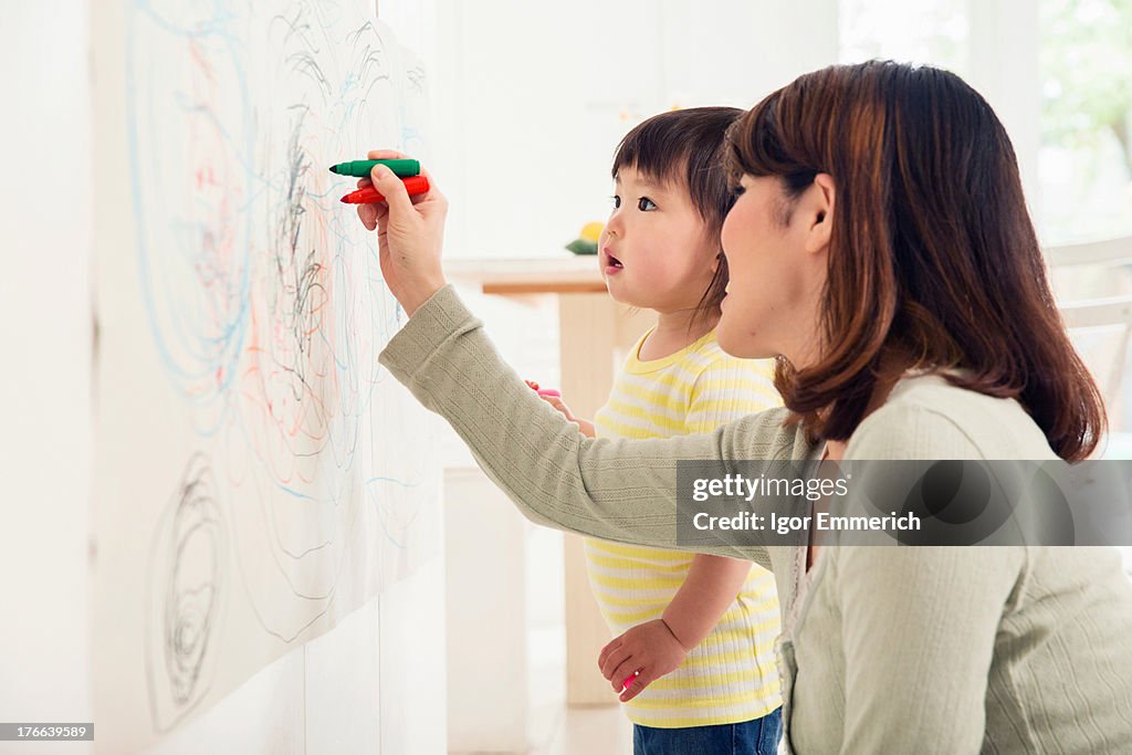 Mother and toddler drawing